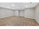 Large basement space with carpet flooring, neutral walls, and recessed lighting at 7746 S Harrison Cir, Centennial, CO 80122