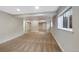 Spacious basement area with carpet flooring, recessed lighting, and bright windows at 7746 S Harrison Cir, Centennial, CO 80122