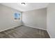 Carpeted bedroom with neutral walls and one window at 7746 S Harrison Cir, Centennial, CO 80122