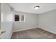 Basement bedroom with cozy carpet, a window for natural light, and fresh neutral walls at 7746 S Harrison Cir, Centennial, CO 80122
