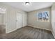 Neutral bedroom with gray carpet, a sliding closet door, and a single window at 7746 S Harrison Cir, Centennial, CO 80122