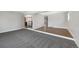 Spacious living area with plush carpet and updated flooring and recessed lighting at 7746 S Harrison Cir, Centennial, CO 80122