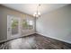 Bright dining room with a door to the outside and a stylish chandelier at 5395 Canyon View Dr, Castle Rock, CO 80104