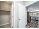 Hallway view leading to the kitchen with gray cabinets and stainless steel appliances at 5395 Canyon View Dr, Castle Rock, CO 80104