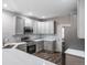 Modern kitchen with stainless steel appliances, quartz countertops, and stylish cabinetry at 5395 Canyon View Dr, Castle Rock, CO 80104