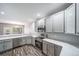 Well-lit kitchen with stainless steel appliances, granite countertops, and gray cabinets at 5395 Canyon View Dr, Castle Rock, CO 80104