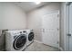 Functional laundry room with modern washer and dryer at 5395 Canyon View Dr, Castle Rock, CO 80104