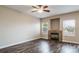 Spacious living room with a cozy fireplace, hardwood floors, and natural light at 5395 Canyon View Dr, Castle Rock, CO 80104