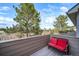 Outdoor patio with seating and scenic views of trees and blue skies at 5395 Canyon View Dr, Castle Rock, CO 80104