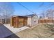 Backyard featuring a shed and a lawn with hardscaped walkway at 3605 E 29Th Ave, Denver, CO 80205