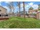 Spacious backyard with well-maintained lawn, wooden fence, mature trees and a deck, perfect for outdoor enjoyment at 5307 E Courtney Ave, Castle Rock, CO 80104