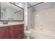Bathroom featuring a deep soaking tub with shower, vanity with modern fixtures, and stylish tile flooring at 5307 E Courtney Ave, Castle Rock, CO 80104