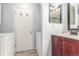 Functional laundry area featuring a sink, cabinetry, and a washer and dryer, seamlessly blending convenience and style at 5307 E Courtney Ave, Castle Rock, CO 80104
