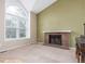 Comfortable living room with fireplace and large window, perfect for relaxation and natural light at 5307 E Courtney Ave, Castle Rock, CO 80104
