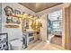 Unique bathroom with a vessel sink, rustic wood vanity, and an open doorway to the bedroom at 3270 S Galapago St, Englewood, CO 80110