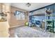 Stylish bedroom featuring a lofted bed above a desk, shelving, and a large window at 3270 S Galapago St, Englewood, CO 80110