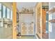 Stylish entryway with decorative shelves, unique storage, and a charming barn door accent at 3270 S Galapago St, Englewood, CO 80110