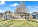 Charming single-story home featuring a cozy front porch and well-maintained lawn on a sunny day at 3270 S Galapago St, Englewood, CO 80110