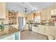 Charming kitchen with stainless steel appliances, custom cabinets, and a farmhouse sink at 3270 S Galapago St, Englewood, CO 80110