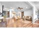 Bright living room featuring hardwood floors, modern furnishings, and an open floor plan at 3270 S Galapago St, Englewood, CO 80110
