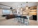 Entertainment bar with seating and modern lighting fixtures creating a relaxing spot at 9563 Red Primrose St, Franktown, CO 80116