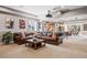 Finished basement with large leather sectional, bar area, projector, and recessed lighting at 9563 Red Primrose St, Franktown, CO 80116