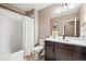 Modern bathroom with shower/tub combination and vanity with light countertop and backsplash at 9563 Red Primrose St, Franktown, CO 80116