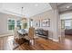 Dining room featuring a chandelier, hardwood floors, natural light and views of the outside at 9563 Red Primrose St, Franktown, CO 80116
