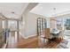 Elegant dining room featuring hardwood floors, decorative mirror and modern chandelier at 9563 Red Primrose St, Franktown, CO 80116