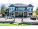 Back of home with stone patio and exterior stairs at 9563 Red Primrose St, Franktown, CO 80116