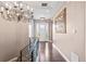 Bright foyer featuring wood floors, modern railings, and a chandelier at 9563 Red Primrose St, Franktown, CO 80116