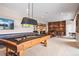 Recreation area with a pool table, shuffleboard and wet bar for entertainment and fun at 9563 Red Primrose St, Franktown, CO 80116