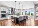 Spacious kitchen with a large island, pendant lighting, modern appliances, and a breakfast nook with scenic views at 9563 Red Primrose St, Franktown, CO 80116