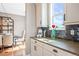 Bright kitchen featuring modern appliances, granite countertops and stylish backsplash tiles at 9563 Red Primrose St, Franktown, CO 80116