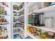 Walk-in pantry featuring custom shelves and ample storage for food and kitchen essentials at 9563 Red Primrose St, Franktown, CO 80116