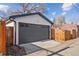 Detached garage with modern overhead door and clean exterior at 826 Madison St, Denver, CO 80206