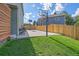 The backyard boasts a basketball court and a tall wooden fence for privacy at 8414 Coralberry Ct, Parker, CO 80134