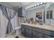 Bathroom featuring a double sink vanity with cabinets and drawers for storage, and shower at 8414 Coralberry Ct, Parker, CO 80134