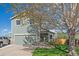 Charming two-story home with a well-maintained lawn, two car garage, and a welcoming front entrance at 8414 Coralberry Ct, Parker, CO 80134