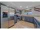 Modern kitchen featuring stainless steel appliances, sleek cabinetry, and granite countertops at 8414 Coralberry Ct, Parker, CO 80134
