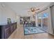 Open-concept kitchen with granite countertops, stainless steel appliances, island seating, and deck access at 8414 Coralberry Ct, Parker, CO 80134