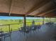 Community deck with tables and chairs overlooking golf course at 42976 Colonial Trl, Elizabeth, CO 80107