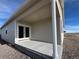 Covered patio with double doors and concrete flooring at 42976 Colonial Trl, Elizabeth, CO 80107