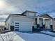 Two-story home with covered porch and attached garage at 42976 Colonial Trl, Elizabeth, CO 80107