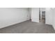Bright bedroom features a walk in closet, neutral paint, and plush gray carpet providing a cozy and inviting space at 761 Muturu Rd, Johnstown, CO 80542