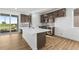 Modern kitchen with a central island, stainless steel appliances, and plenty of counter space at 761 Muturu Rd, Johnstown, CO 80542