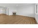 Spacious, modern living room with a sleek fireplace and lots of natural light from the door and windows at 761 Muturu Rd, Johnstown, CO 80542