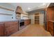 Clean kitchen featuring wood cabinets, white subway tiles and stainless steel appliances at 776 Hilltop Rd, Palmer Lake, CO 80133