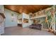 Bright living room with high wood ceiling, stone fireplace and view of loft at 776 Hilltop Rd, Palmer Lake, CO 80133