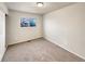 Spacious carpeted bedroom with double door closet and window at 10968 Grange Creek Dr, Thornton, CO 80233